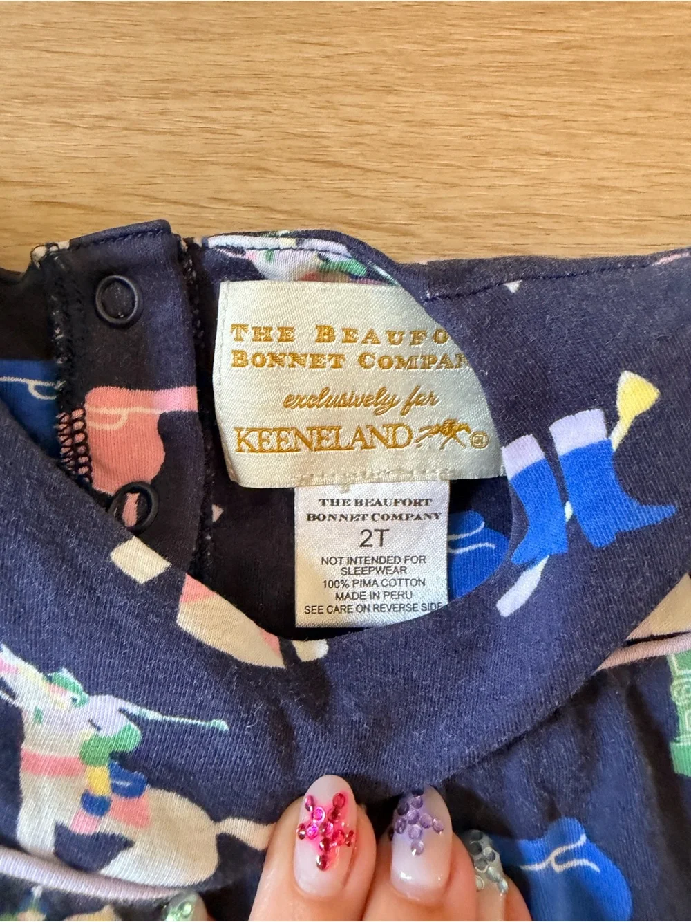 The Beaufort Bonnet Company Navy Short-Sleeve One-Piece with Pastel Jockey Print